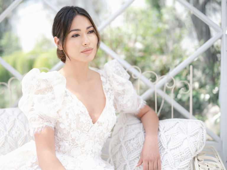 Bride sitting on sofa in orangery